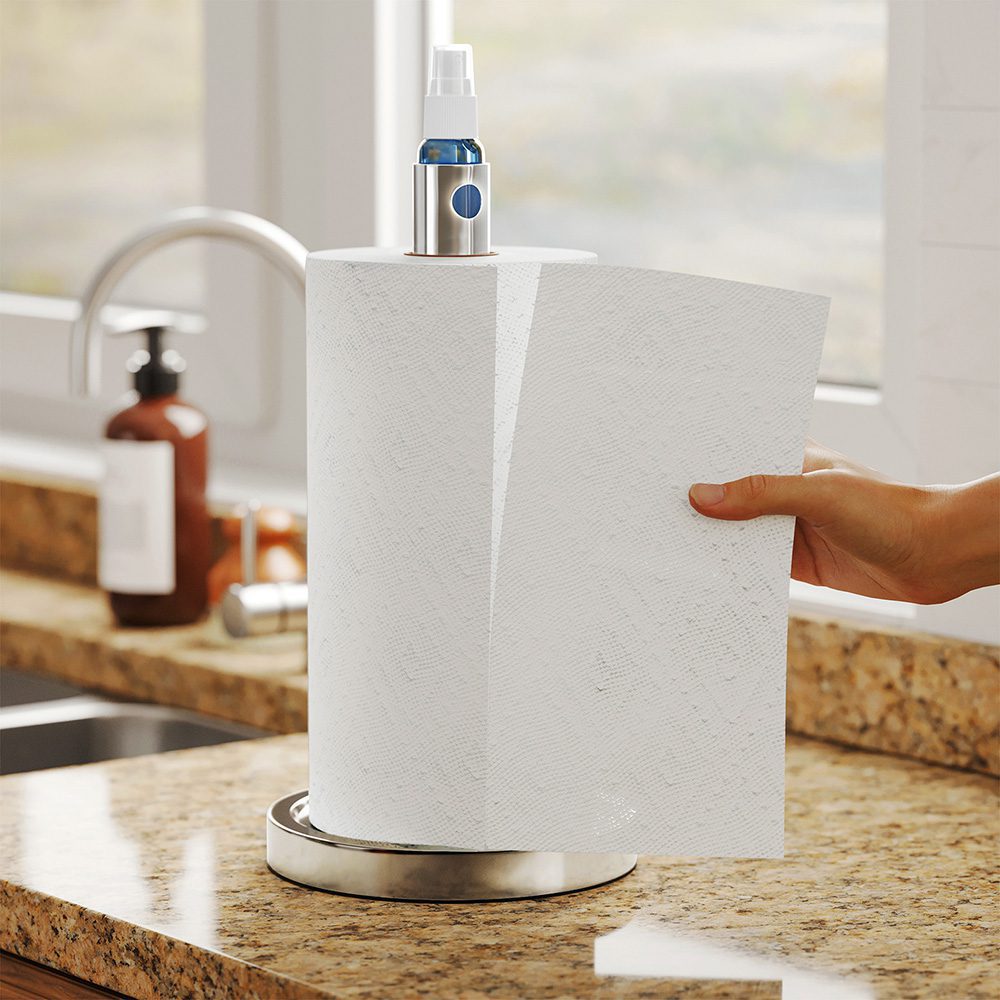 Under cabinet outlet paper towel dispenser