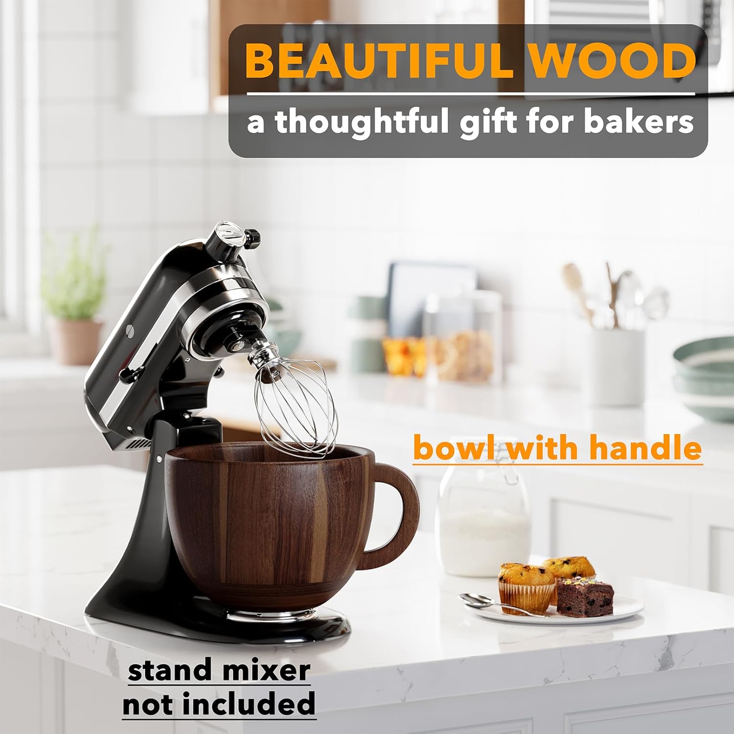 Stand mixer with wooden bowl on a kitchen counter, surrounded by baked goods and utensils.
